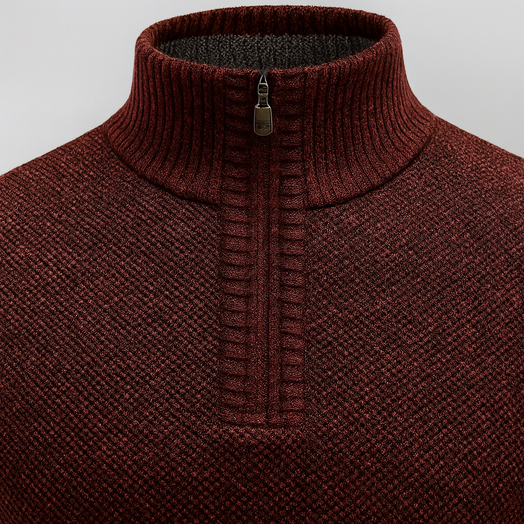 A knit pullover sweater with a half-zip mock neck and ribbed cuffs and hem.