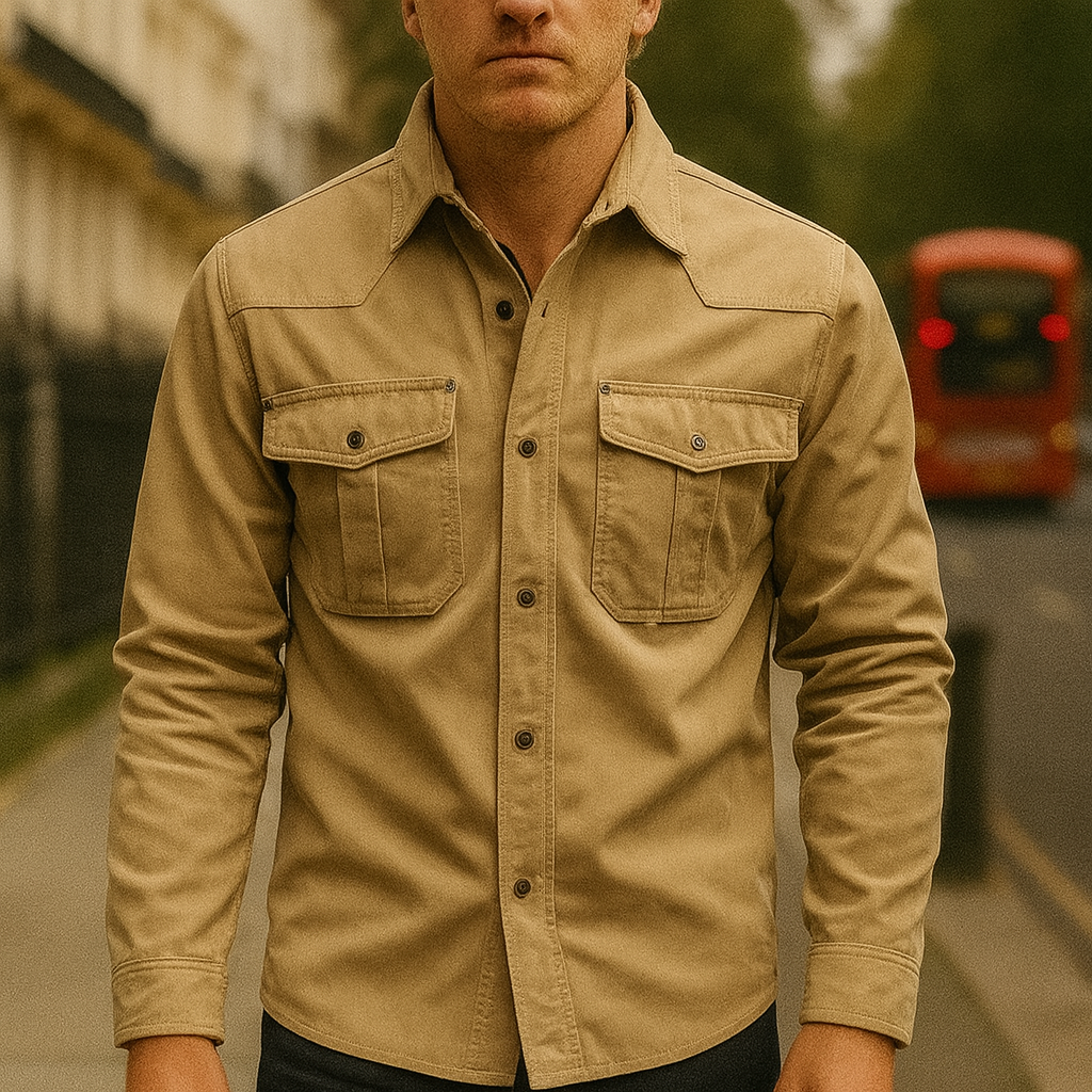 A button-up workwear jacket with flap chest pockets, long sleeves, and a plaid inner lining.