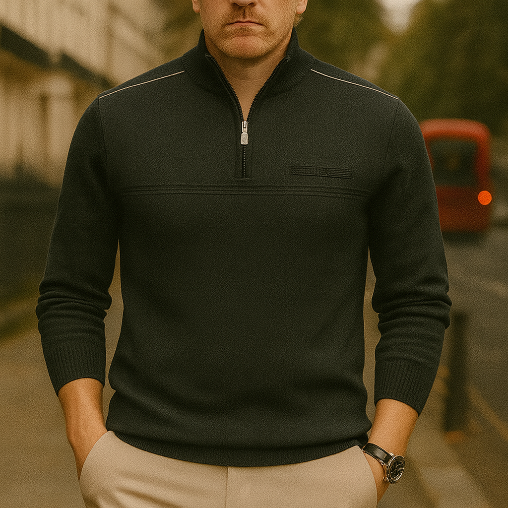A long-sleeve knit pullover with a half-zip front, ribbed cuffs, and subtle shoulder detailing.
